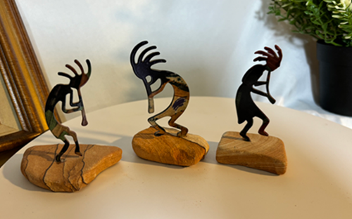 Musical Kokopeli Figurines on Rocks