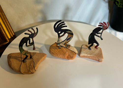 Musical Kokopeli Figurines on Rocks
